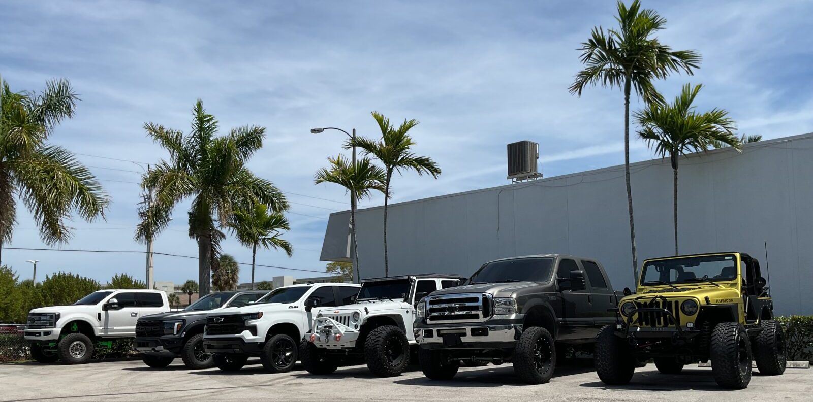 DV8 Motorsports Lake Park shop with custom trucks and Jeeps